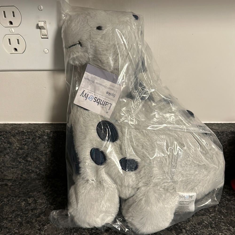 Brand new, unopened Lambs and Ivy Spike (dinosaur)